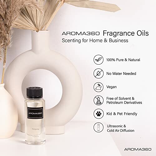 Aroma360 fragrance oils with reed diffuser in background