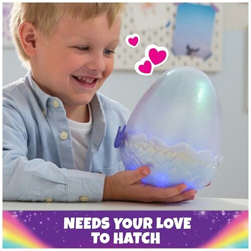 Child smiling at glowing hatching toy egg.
