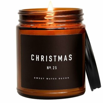 Brown jar candle labeled Christmas No. 25 with lit flame.