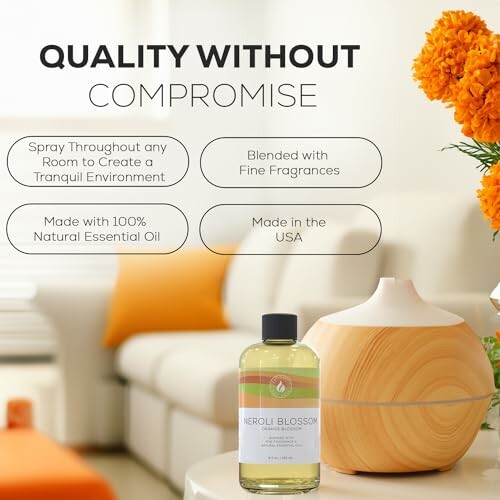 Essential oil bottle and diffuser in a cozy living room setting with orange flowers.