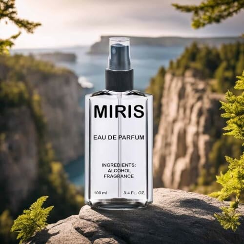 Miris eau de parfum bottle on a rock with scenic background