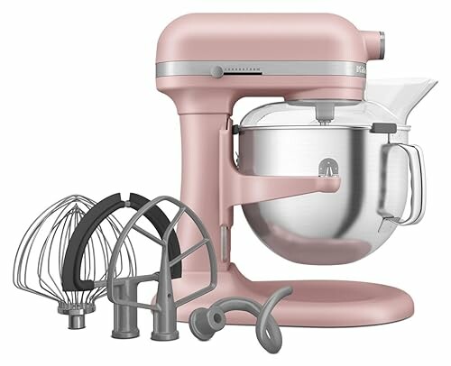 A pink stand mixer with various attachments, perfect for versatile baking