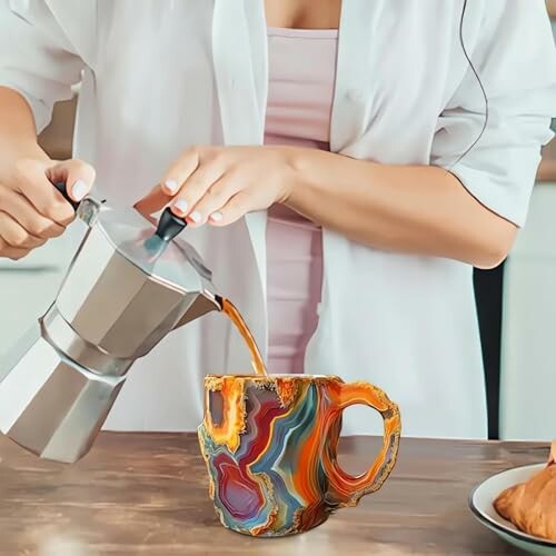 Person pouring coffee into a colorful mug.